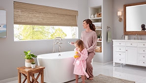 Mother and Daughter at Bathtime Using Motorized Shades