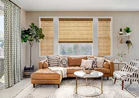 Roman shades on 3 windows in a living room