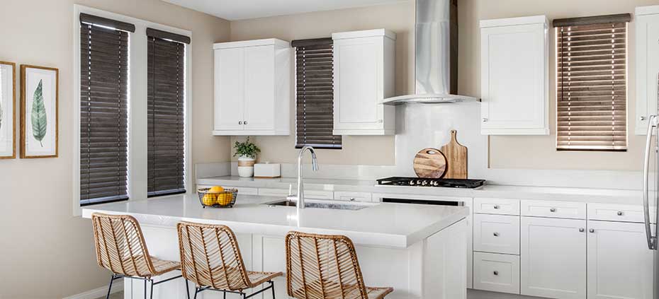 Learn more about bringing textured window treatments into your home Faux Wood Blinds in a clean kitchen