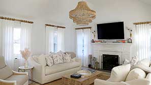 Curtains in a living room overlooking the ocean