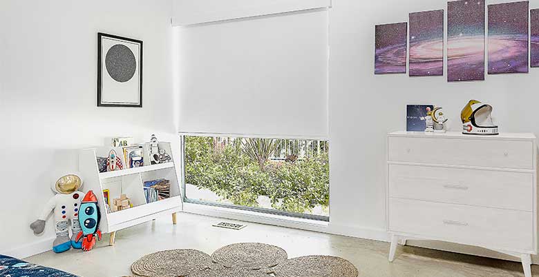 Childs bedroom with white roller shades