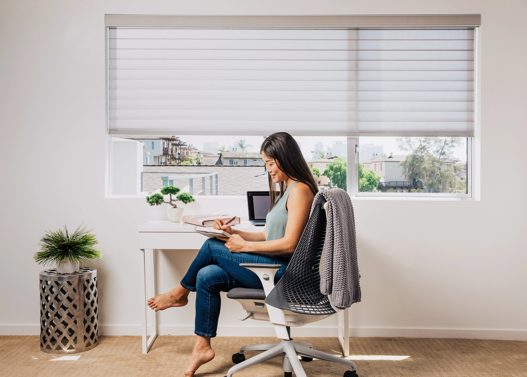 Woman viewing 3 Day Blinds social media