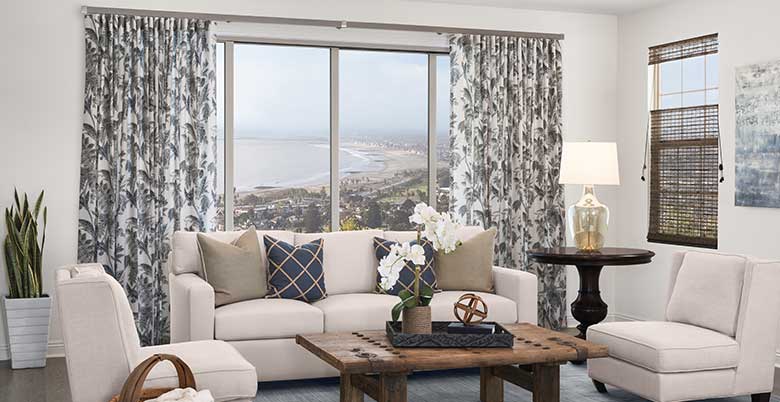 Custom Floral Drapery and Woven Wood window treatments in a living room