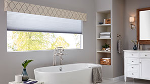 Cellular Shades and a Cornice inside a modern bathroom