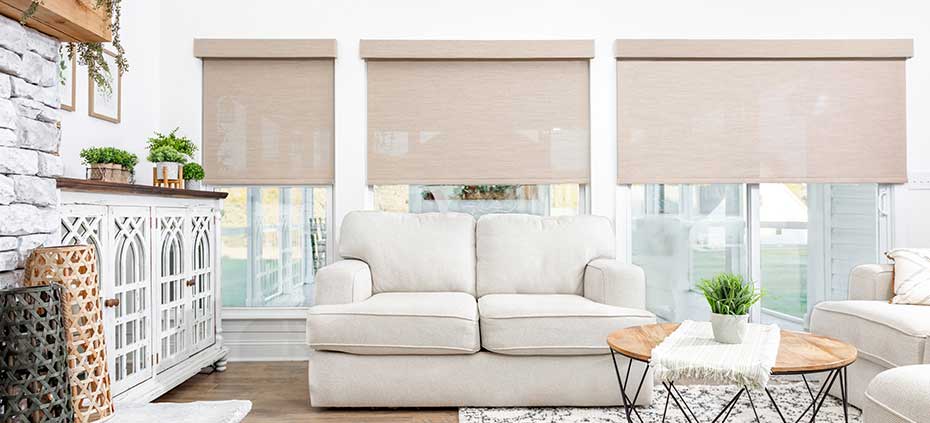 Farmhouse living room with custom roller shades